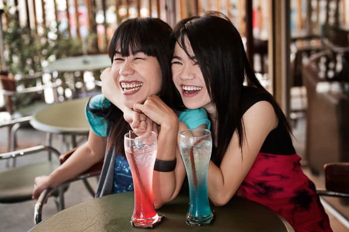 A portrait of two female friends shot with flash photography