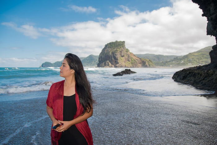 Portrait of a woman on a beach shot with flash photography 