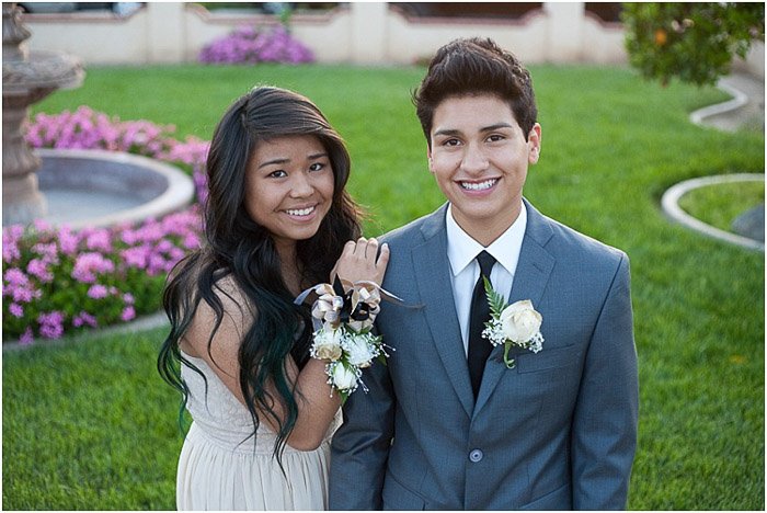 Cute prom pictures of a teen couple posing outdoors