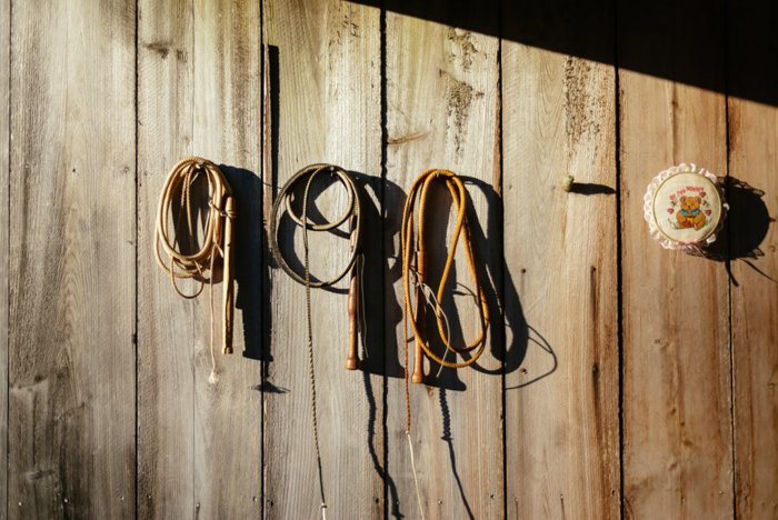 ropes hanging on nails on a wood wall - photo editing tips for smartphone photography