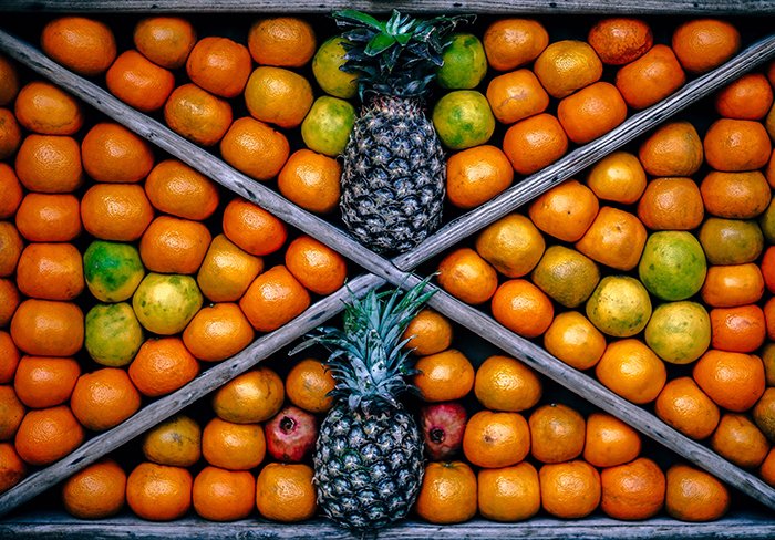 an exciting still life composition featuring fruit, shot with the help of symmetry in photography