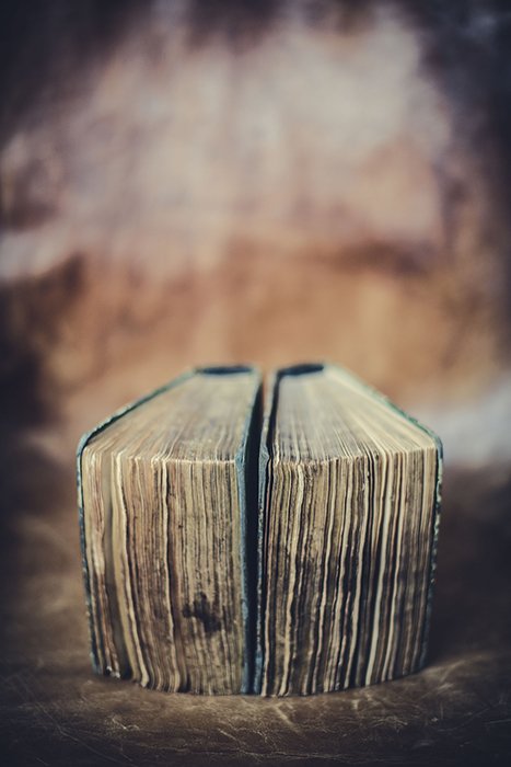 A still life of old books using symmetry in photography composition 