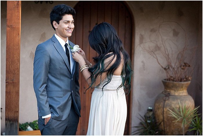 Cute prom photography of a teen couple posing outdoors
