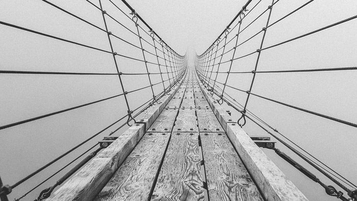 A black and white photograph of a bridge which demonstrates using the principle of art and design in photography