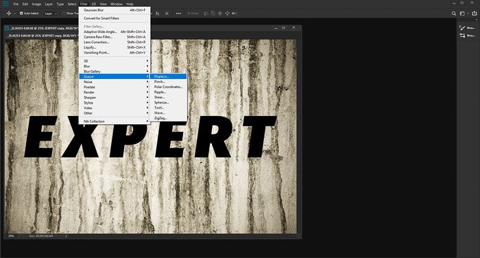 A screenshot of editing a photo of a textured grunge wall with the word 'expert' using the displacement map photoshop