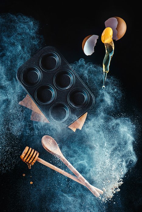 A magical still life shot using kitchen utensils and flour clouds 
