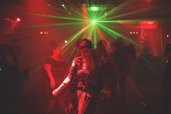 Atmospheric nightclub photography portrait of a female dancer