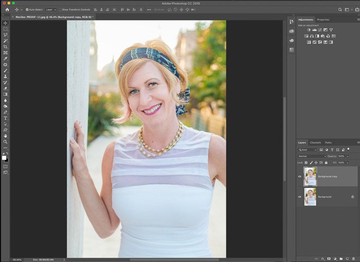 A screenshot showing how to use the Photoshop warp tool for editing portrait photography
