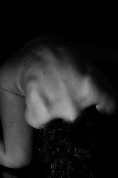 A black and white abstract body photography shot taken from above the model