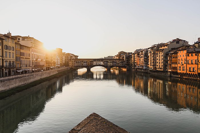 A stunning view of the river in Florence at sunset