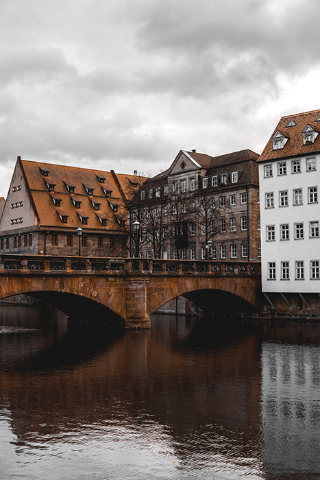 A pretty stone bridge over a river in Nuremberg, Germany