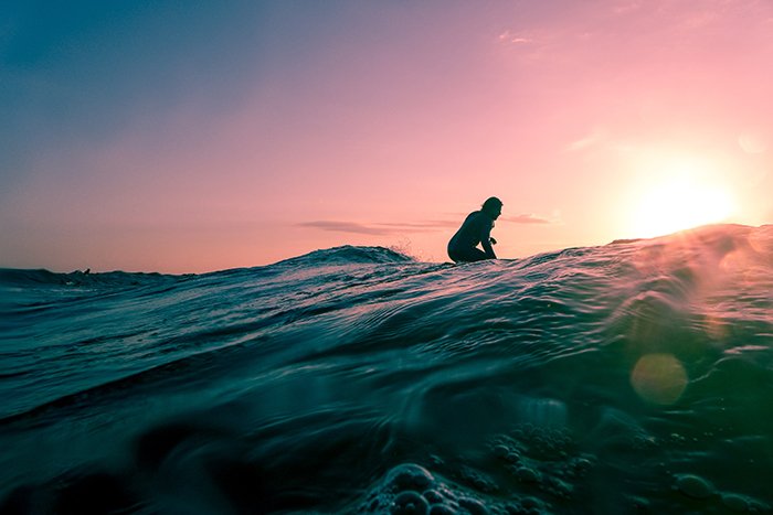 Atmospheric evening shot of a surfer 