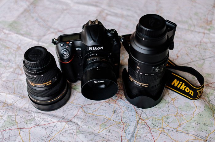 Nikon camera and camera gear resting on a map