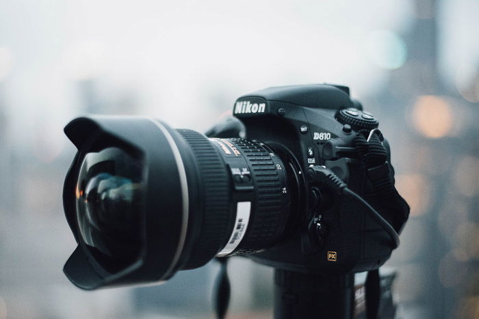 A Nikon DSLR set up on a tripod