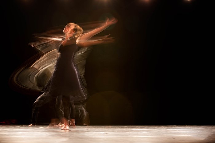 Atmospheric dance photography shot of a female dancer mid performance