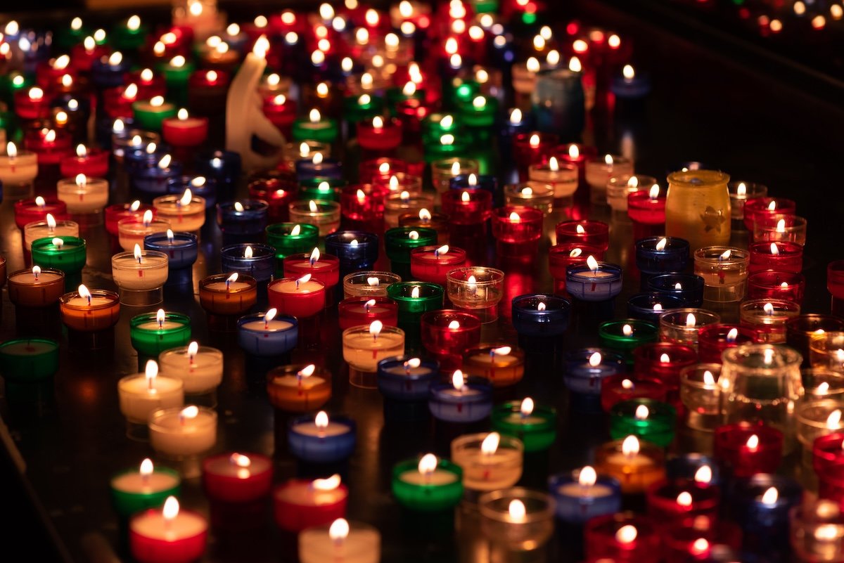 Numerous colorful votive candles for conceptual fire photography