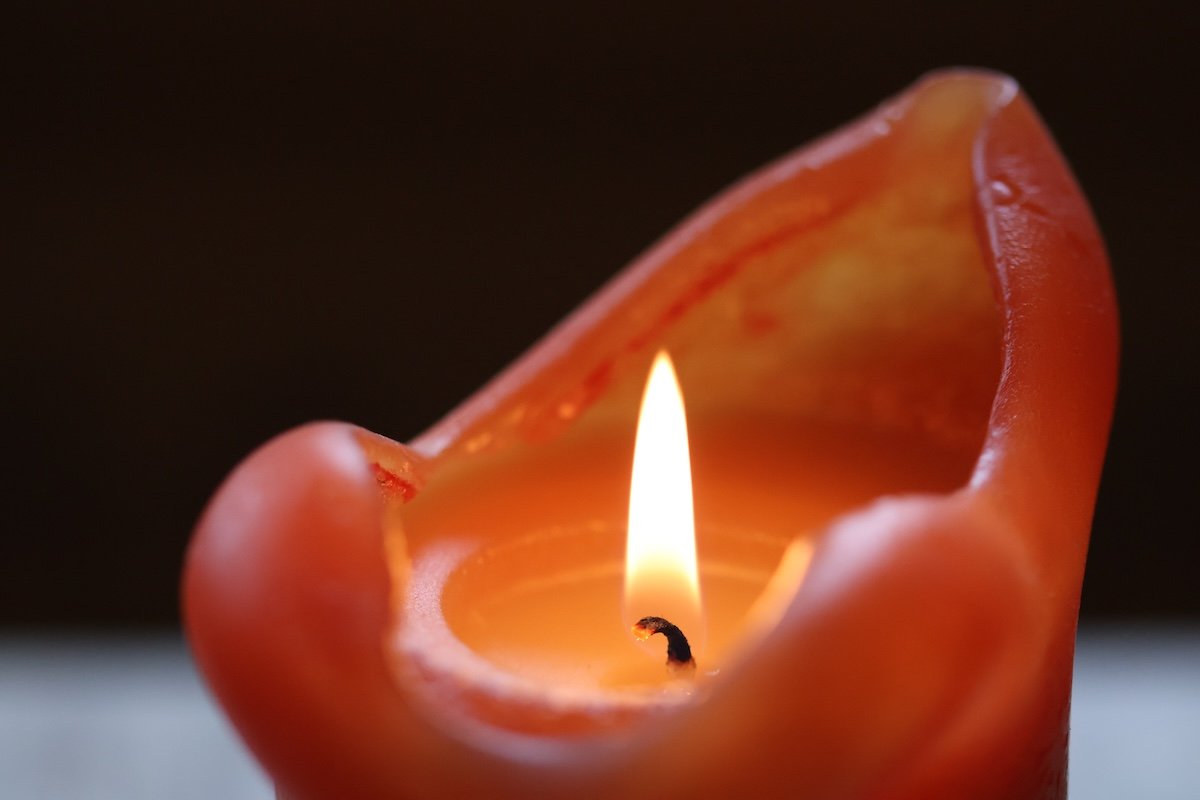 Close-up of a lit red candle for fire photography