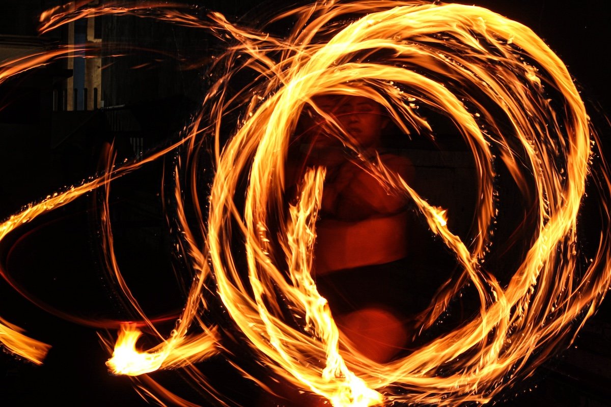 Long exposure of a fire dancer for fire photography