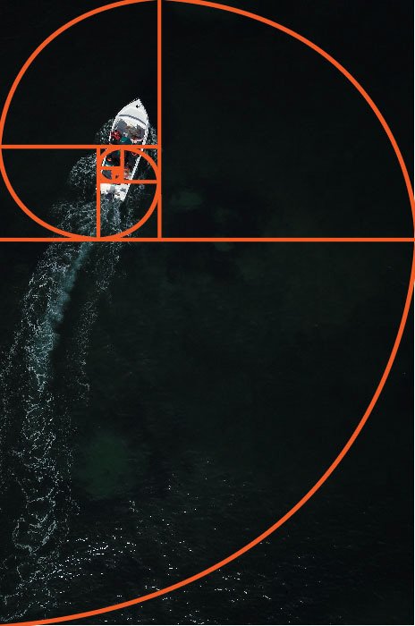 An aerial photo of a boat at sea with the golden ratio grid overlayed 