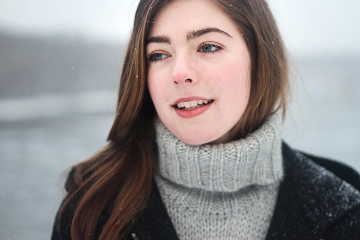 A portrait of a female model in the snow