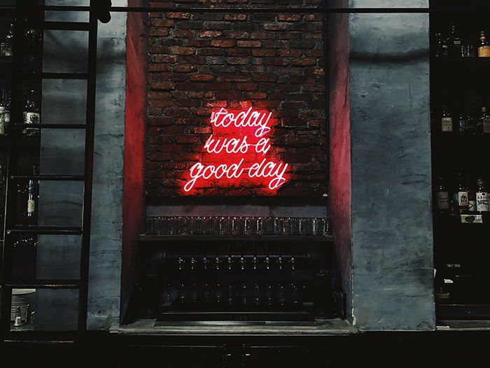 A photo of a red neon sign reading 'today was a good day' - neon signs photography