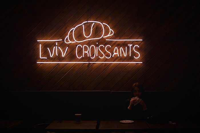 A photo of a neon sign for croissants - neon light photography