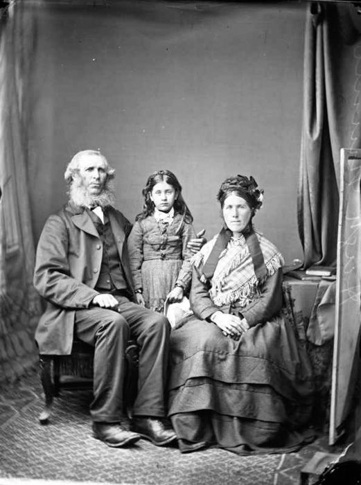 An old black and white studio portrait of a family