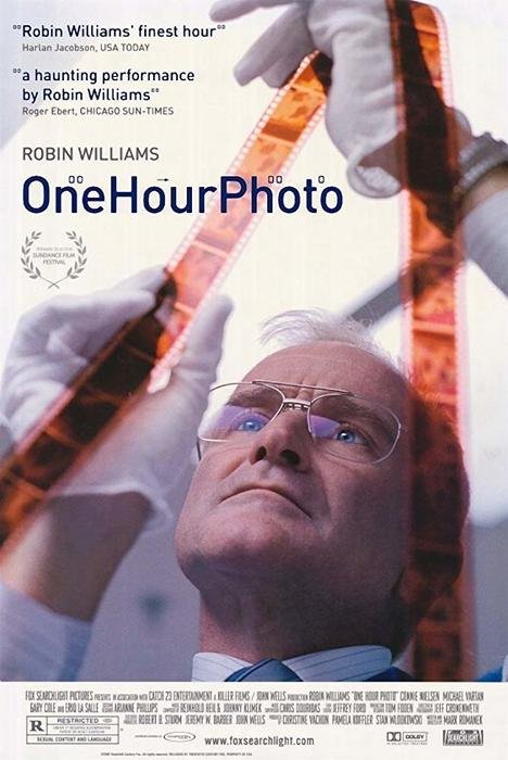 The film poster for One Hour Photo - 2002, a photography movie