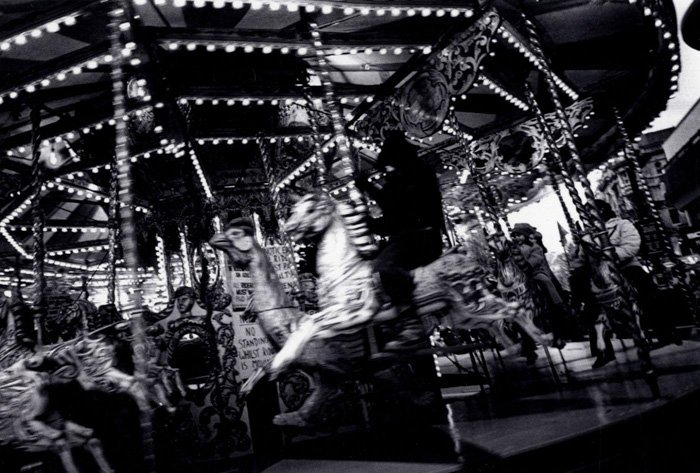 A black and white photo of a carousel by Daidō Moriyama