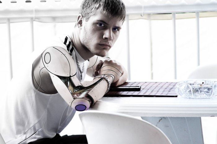 A portrait of a male model with a robotic arm - types of stock photos to avoid