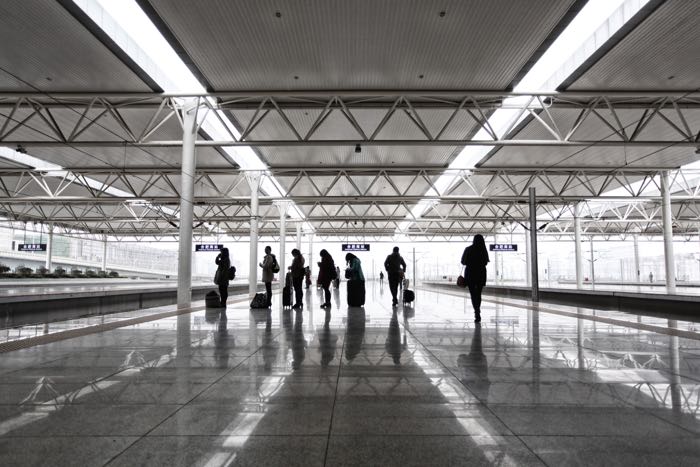 People waiting for a train at a station platform