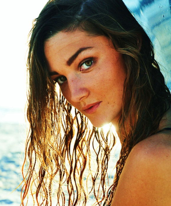 A portrait of a female model posing outdoors 