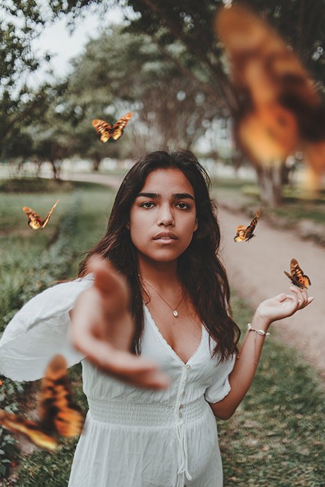 A conceptual photography portrait using Butterflies to symbolise freedom and Creativity
