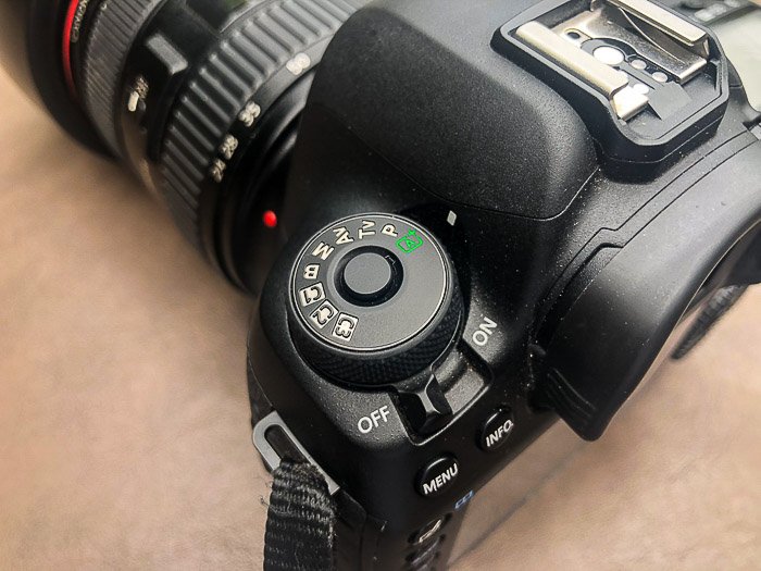 A close up of settings on a DSLR camera - different parts of a camera
