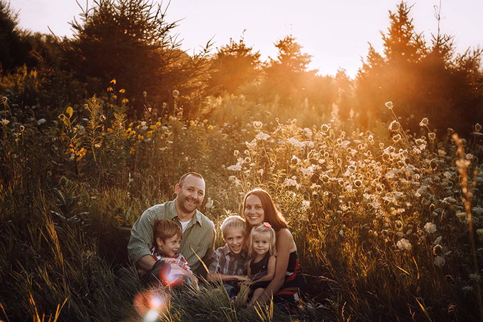 Family portrait in a backlit scene.