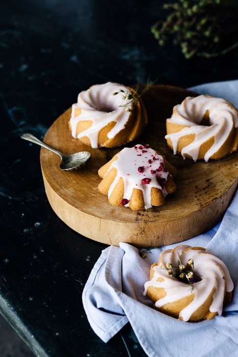 Frosted pastries on a wooden board - food photography examples