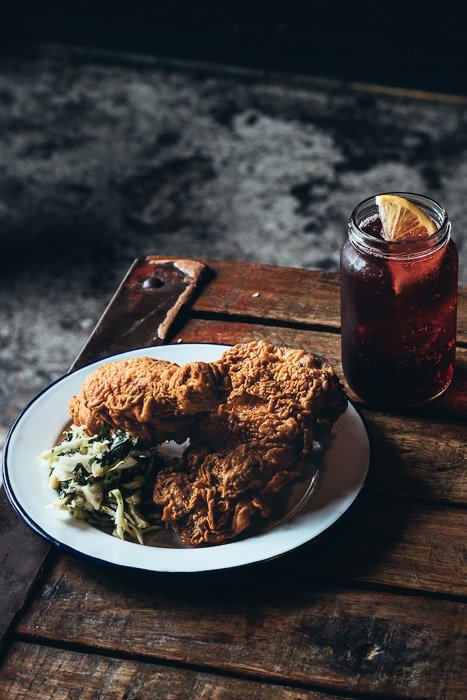 A rustic shot of breaded meat on a wooden board - food photography examples