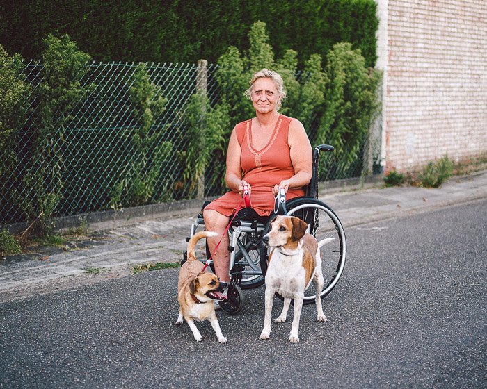 A portrait of a woman in a wheelchair outdoors