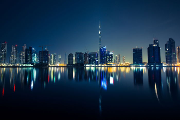 reflection of a city skyline at night