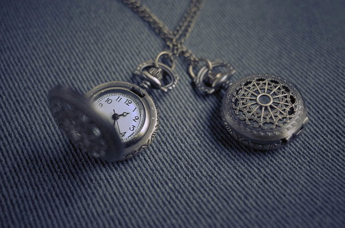 A close up product photography shot of a pocket watch