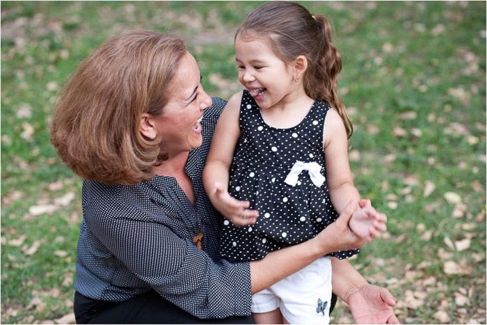 A portrait of a mother and daughter outdoors