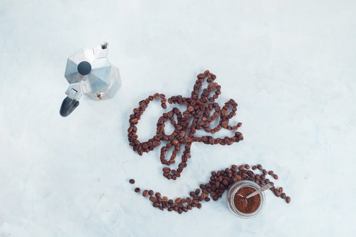 A creative flat lay of food typography and coffee beans 
