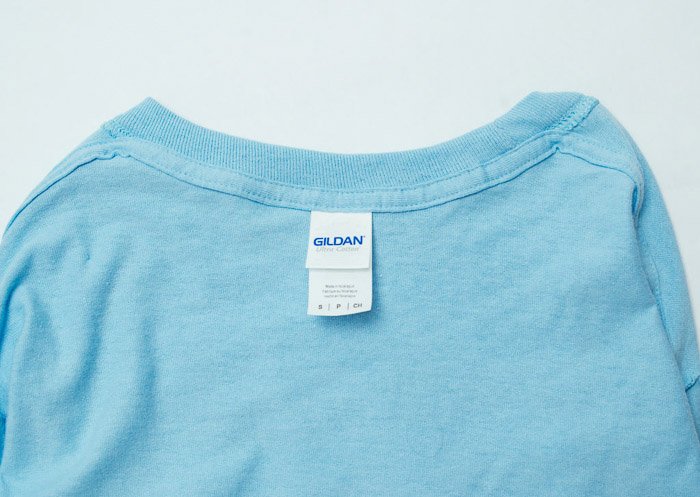 A clothing product shot of an inside out blue t-shirt 