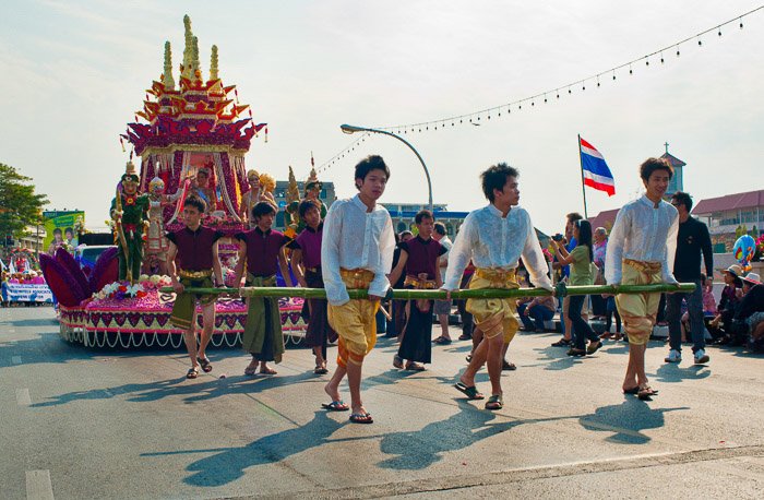 Street photo series of participants in the annual flower festival parade in Thailand