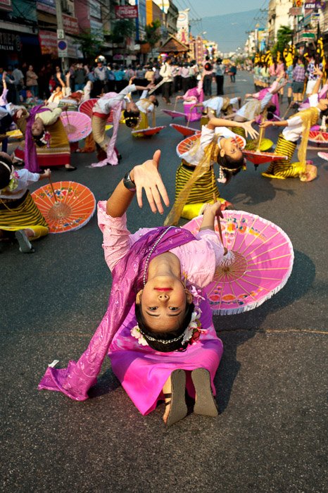 A narrative photography shot of a street performer in Thailand - visual storytelling