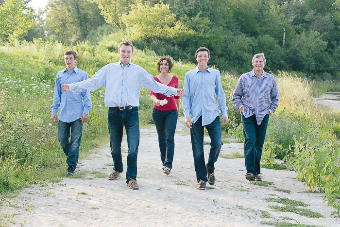 A large group posing for a family portrait outdoors 