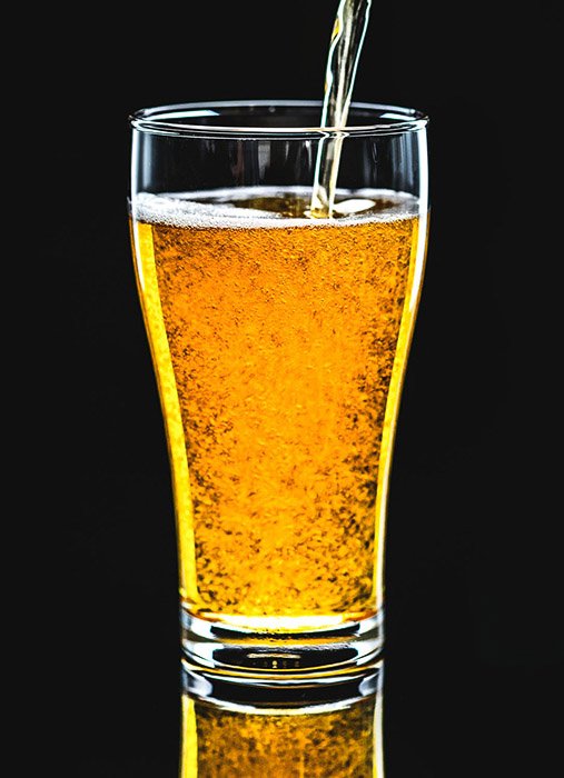 Beer photography shot against black background