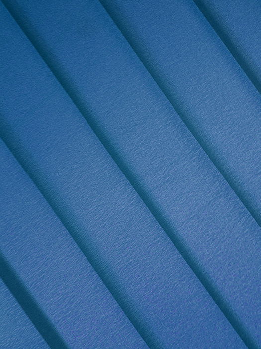 An abstract composition of sheets of blue colored paper - creative abstract photos ideas