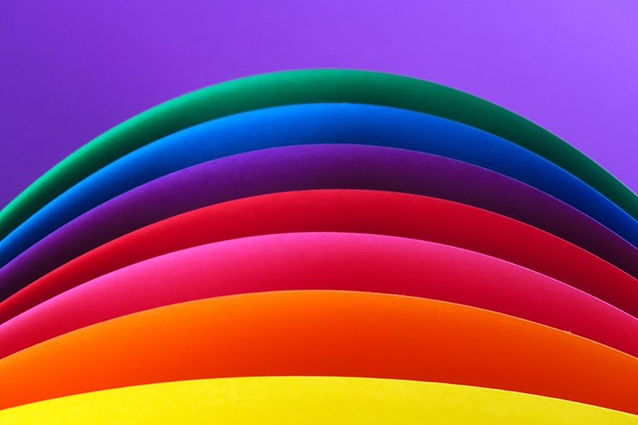 An abstract composition of rainbow colored paper - creative abstract photos ideas