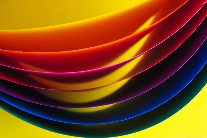 Abstract close up of sheets of brightly colored paper